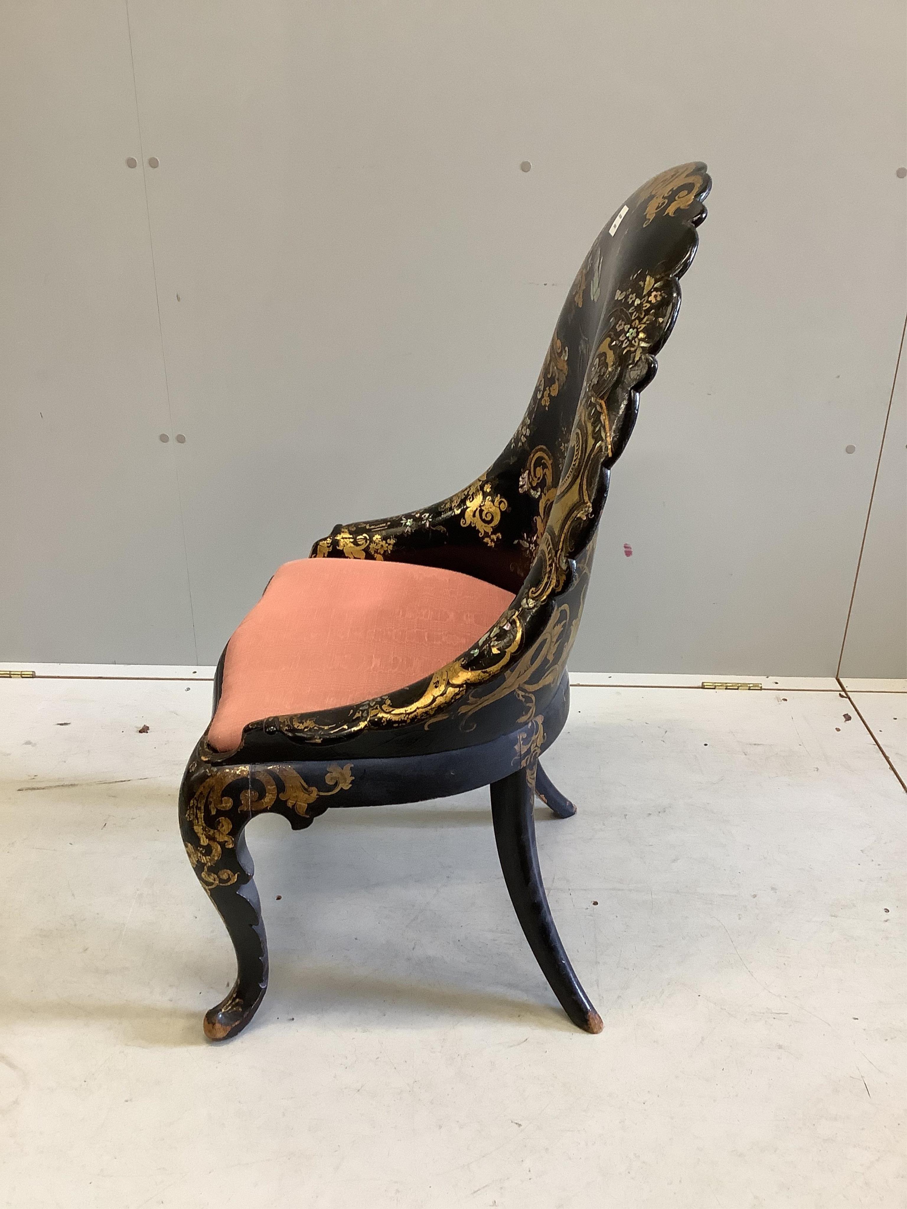 A Victorian papier mache salon chair, with mother of pearl inlay and registration number on the back, width 60cm, height 95cm. Condition - small areas of wear but essentially good condition